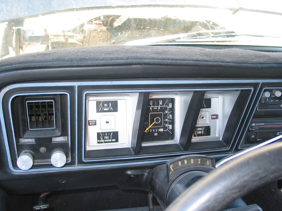 Ford truck dashboard gauge cluster with speedometer, fuel gauge and column-shift PRND21 indicator