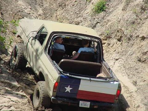 1978 Ford Bronco - This 1978 Ford Bronco is navigating a steep, rocky incline off-road.