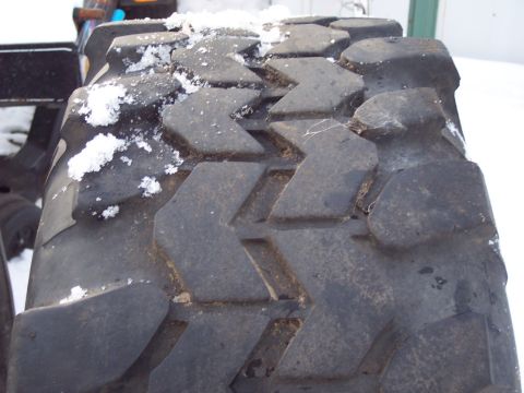 1974 Ford Bronco - Tire tread with snow visible.