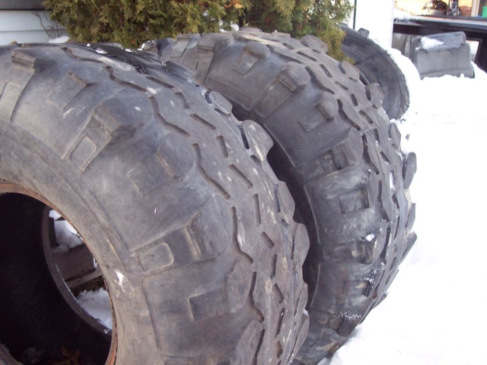 Tires with aggressive tread pattern piled in snow