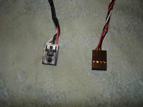 1999 Ford Contour - Close-up of two different electrical connectors, one gray and one brown, with visible wiring.