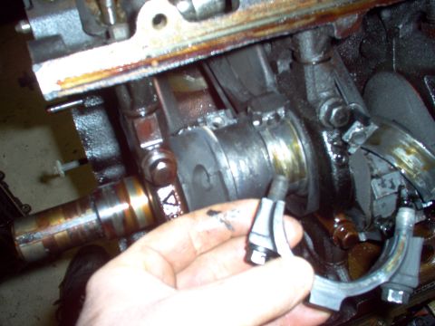 1994 Ford Crown Victoria - The 1 cap was harder to remove because one of the bolts nearly seized. After prying what was left of the bearing off the journal, I could s…