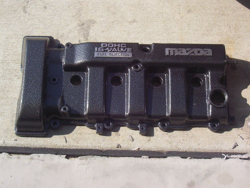 Mazda DOHC 16-valve fuel injection valve cover, dark metallic finish