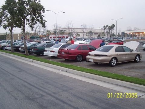 2002 Ford Taurus - A gold sedan is parked with its hood open at a car meet on January 22, 2005.