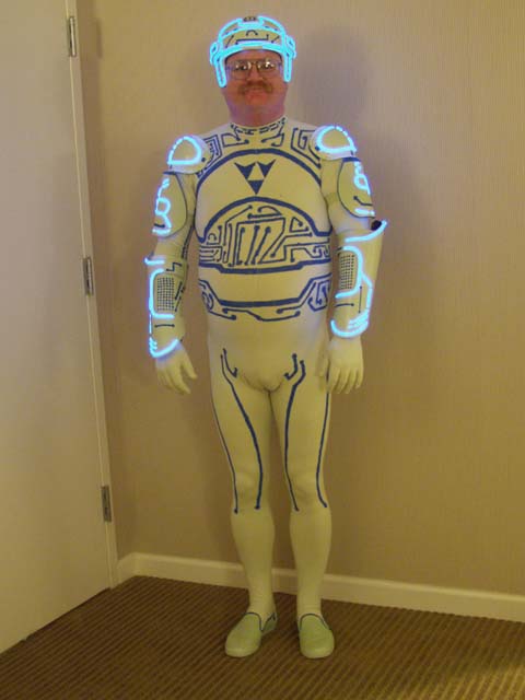 1990 Ford Bronco - A person is dressed in a detailed Tron-inspired costume, complete with a helmet and illuminated blue lines.