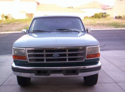 1996 Ford Bronco - Front view of a 1996 Ford Bronco parked in a driveway.
