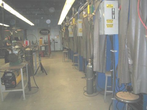1991 Ford Bronco - Interior view of a workshop multiple welding stations and associated equipment.