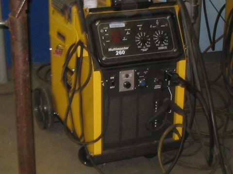 1991 Ford Bronco - A yellow Multimaster 260 welding machine is shown with various cables and controls visible.