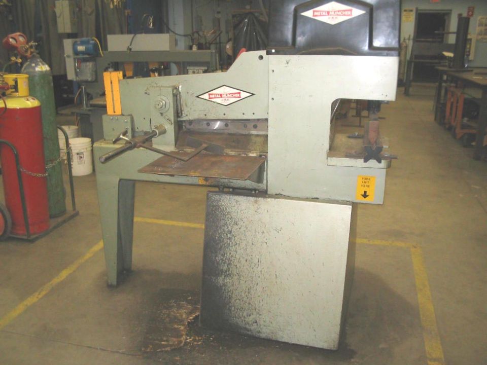 metal shear machine with "METAL MUNCHA" logo
