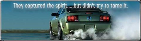 2000 Ford Mustang - A green Ford Mustang performs a burnout, generating a large cloud of smoke against a blue sky.