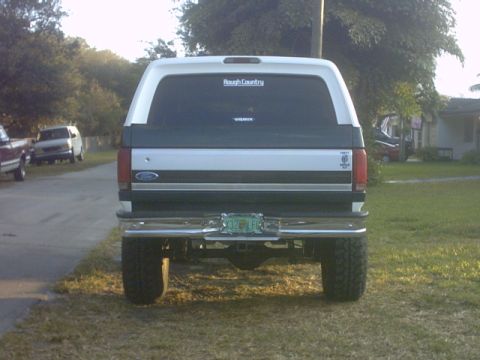 1992 Ford Bronco - Rear view of a lifted 1992 Ford Bronco with "Rough Country" sticker on the rear window.