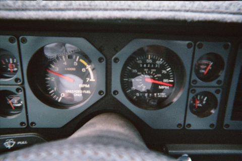 1985 Ford Mustang - The interior of a 1985 Ford Mustang shows its instrument cluster with gauges and a steering wheel.