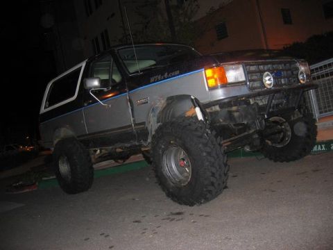 1989 Ford Bronco - This lifted 1989 Ford Bronco features large off-road tires and a custom front bumper.