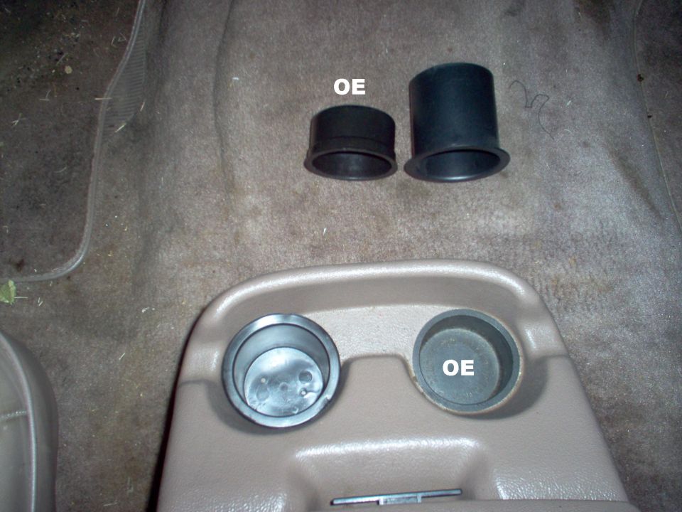The aftermarket cupholders came from a boating supply store.  They're deeper, and have a slightly wider lip than the factory parts.