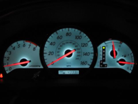 2004 Toyota Solara - Dashboard gauges of a 2004 Toyota Solara display mileage, speed, RPM, fuel level, and gear selection.