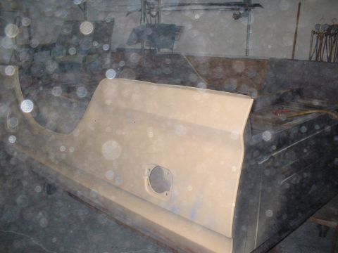1978 Ford F-250 - Unpainted truck door panel with a circular cutout is shown in a workshop setting.