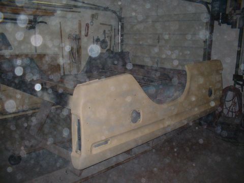 1978 Ford F-250 - A truck bed side panel is shown in a garage, possibly undergoing restoration.