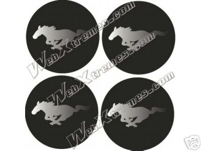 2002 Ford Mustang - Set of four Ford Mustang running horse emblems, some with watermarks and a SuperMotors.net logo at the bottom.