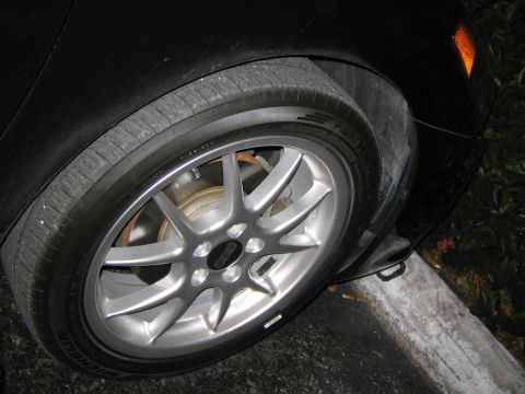 2004 Toyota Solara - Silver multi-spoke wheel with BBS logo on a black car's tire.