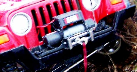 1999 Jeep TJ - This Jeep features a winch on its front bumper, ready for off-road adventures.