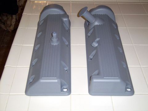 2002 Ford Mustang - Pair of grey valve covers shown on a tiled surface.