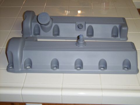 2002 Ford Mustang - A pair of engine valve covers are shown, likely before installation or painting.