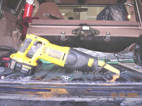1994 Ford Bronco - i cut mine with the tank still inplace. I used a sawzall at approximately this angle