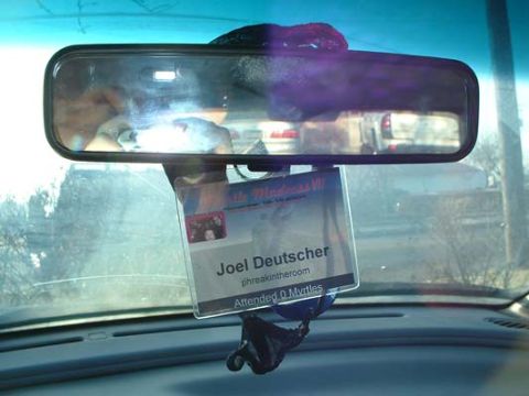 1993 Ford Probe - Interior view of a rearview mirror with an ID badge hanging from it.