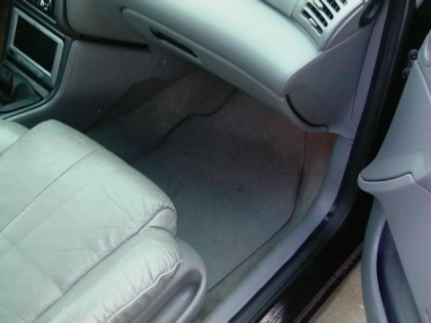 1995 Ford Contour - Interior view of a car's passenger side, focusing on the seat and floor area.