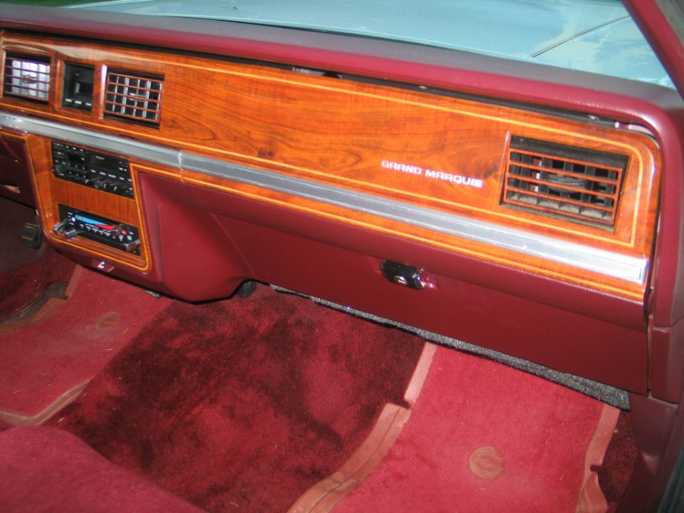 Mercury Grand Marquis woodgrain dashboard and burgundy interior, passenger side