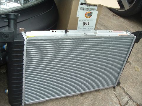 1993 Ford Taurus - A radiator part is shown, with a label indicating part number 891 and a reference to a 1993 Ford Taurus/Mercury Sable.