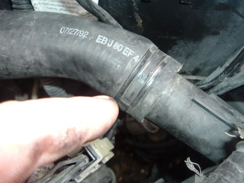 1993 Ford Taurus - A hose with a date stamp of 07/27/92 is visible in the engine bay.