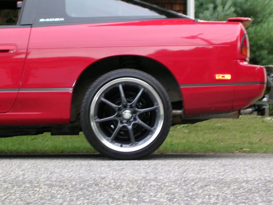 red coupe rear wheel and fender