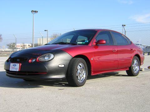1997 Ford Taurus - This 1997 Ford Taurus is parked outdoors under a clear blue sky.