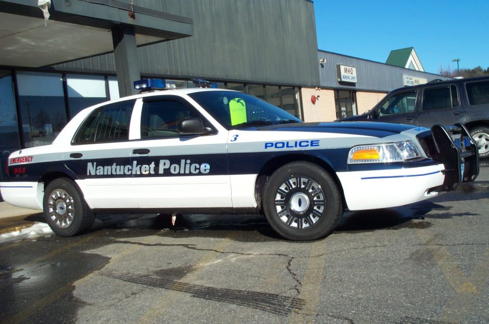 Police car with Nantucket Police text on the side. It's a 2001 Ford Crown Victoria