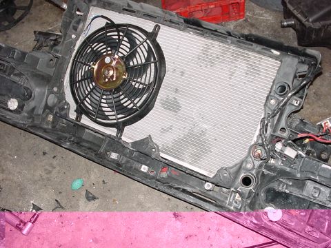 1998 Volkswagen Jetta - Radiator and fan assembly, likely from a vehicle, shown removed from its original context.