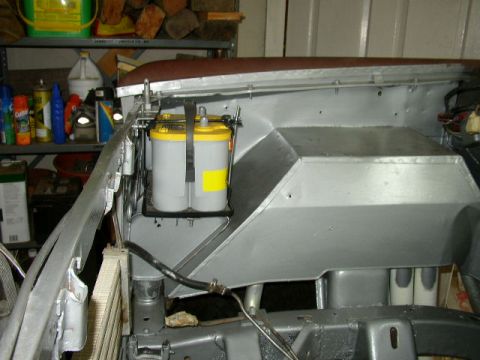 1995 Ford Bronco - Engine bay detail with a yellow-top Optima battery installed.