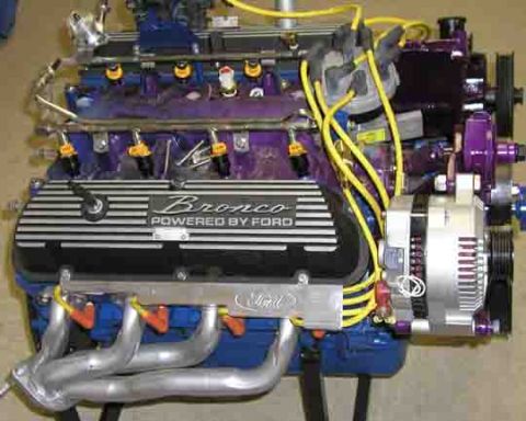 1988 Ford Bronco - This engine features a valve cover clearly marked "Bronco POWERED BY FORD", indicating it belongs to a Ford Bronco.