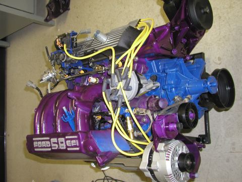 1988 Ford Bronco - A custom-painted Ford 5.8L V8 engine is shown, bright purple and blue accents.