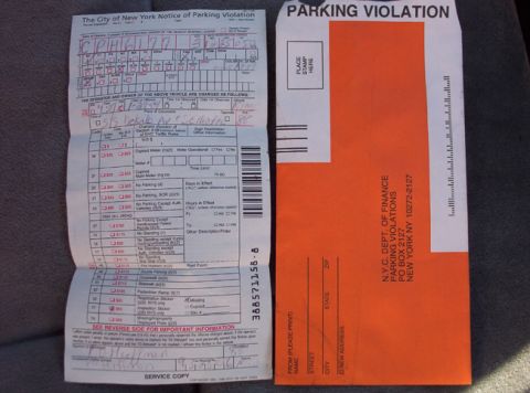 1991 Ford LTD Crown Victoria - A parking violation notice and its accompanying envelope are displayed.