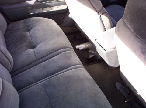 1991 Ford LTD Crown Victoria - The interior of a 1991 Ford Crown Victoria LTD shows gray velour seats and door panels.