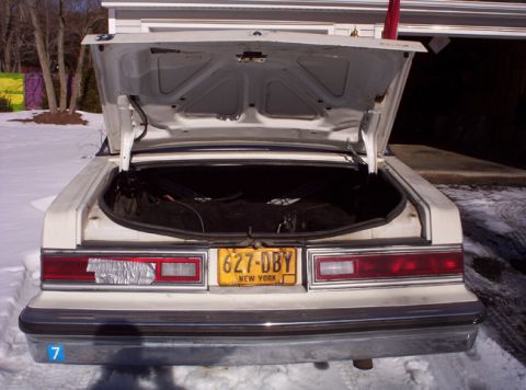 1991 Ford LTD Crown Victoria - Rear view of a 1991 Ford Crown Victoria LTD, trunk open, on a snowy day.