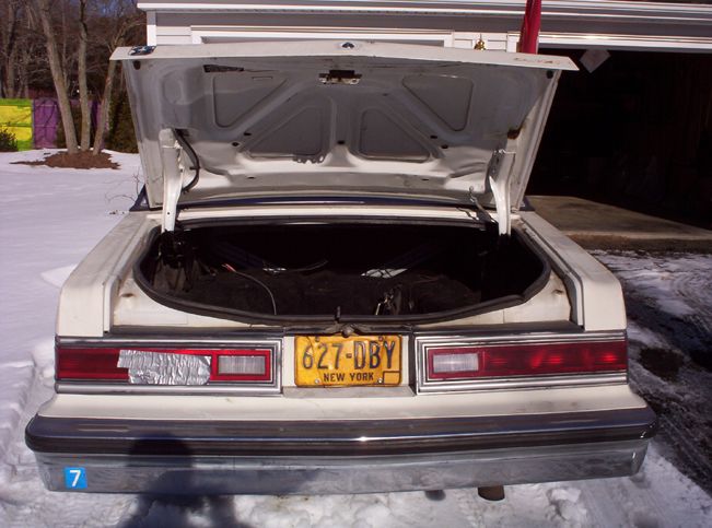 1991 Ford Crown Victoria LTD rear with trunk open, showing yellow New York license plate 627-DBY