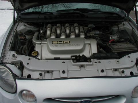 1997 Ford Taurus - The engine bay of a 1997 Ford Taurus SHO V8 is visible with the hood open.