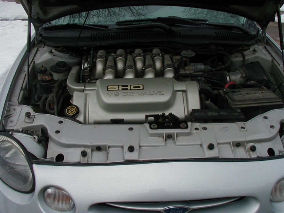 Silver 1997 Ford Taurus SHO V8 engine bay, front view, hood open