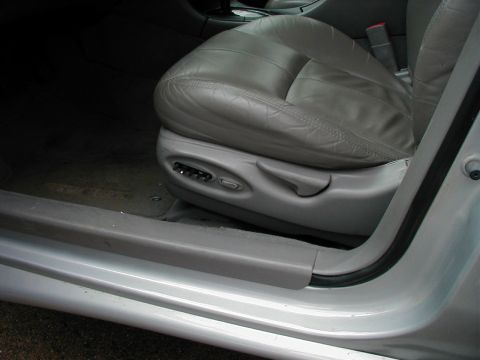 1997 Ford Taurus - Power seat controls are visible on the driver's side of this 1997 Ford Taurus interior.