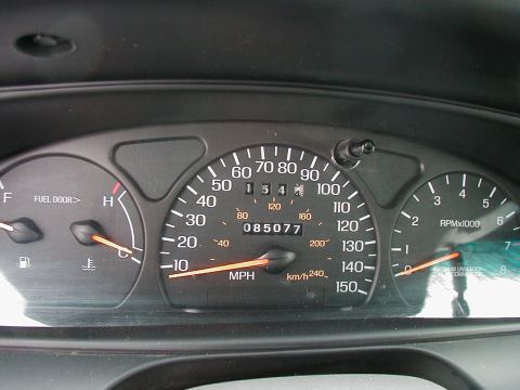 1997 Ford Taurus - Interior view of a car's instrument cluster showing various gauges and odometer reading.