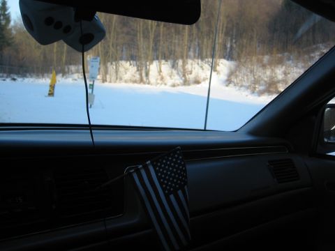 1992 Ford Crown Victoria - View from inside a 1992 Ford Crown Victoria, looking out at a snow-covered landscape.