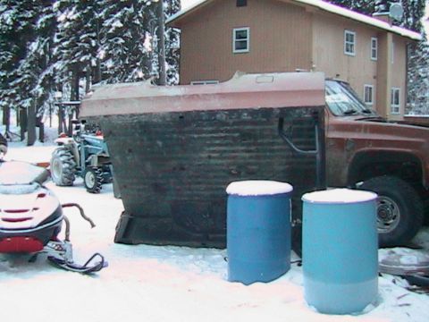 1981 Chevrolet C/K Pickup - A 1981 Chevrolet C/K Pickup truck bed and cab are visible in a snowy outdoor setting with other vehicles.