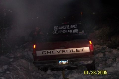 1981 Chevrolet C/K Pickup - Chevrolet pickup truck with a humorous sticker, stuck in the snow at night.